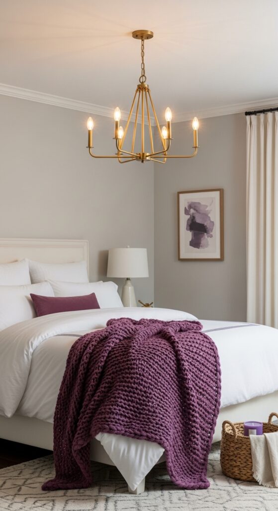 Gold Chandelier Above White Bedding with Purple Throw